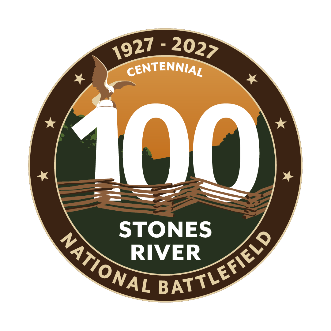 Circular centennial logo for Stones River National Battlefield (1927–2027) featuring a large “100” behind a split-rail fence, an eagle statue silhouette, and a sunset over wooded hills, with “Centennial” and “Stones River National Battlefield”