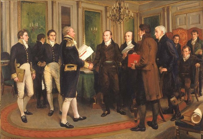 Painting of a room of 11 men; two in the center are shaking hands as one holds the Treaty of Ghent.