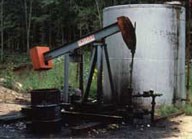pump jack and large tank