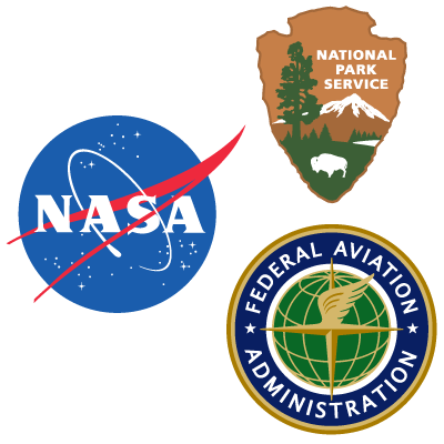 A blue NASA logo, brown NPS arrowhead and blue and gold FAA logo