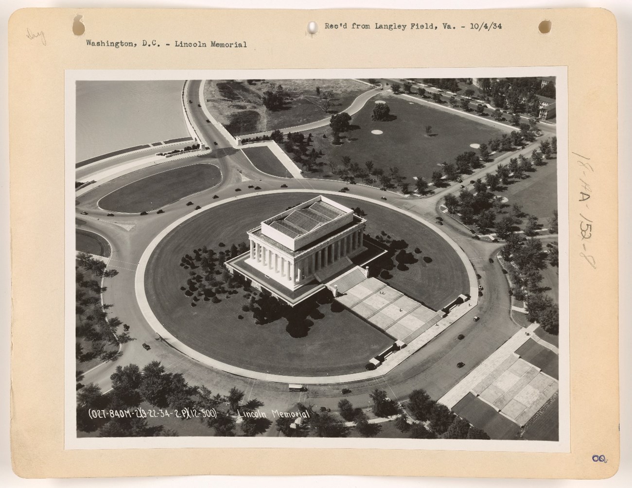 Aerial view of the designed landscape around Lincoln Memorial in 1934, including a circular drive, walkways, and planted vegetation.