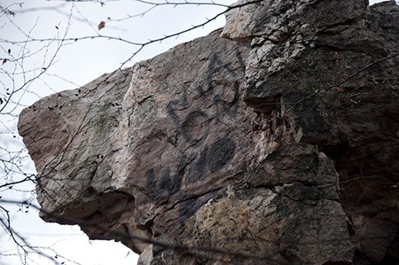 Close-up of graffiti on the square-shaped Wolf Rock