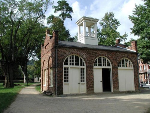 John Brown's Fort, originally a fire engine and guard house, is brick with three arched doorways.