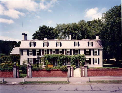 Contemporary image of the Old House, a two-story home with many windows.
