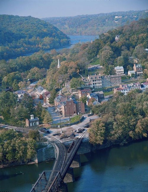 Aerial view of Harpers Ferry, showing the town surrounded by rivers and hills.