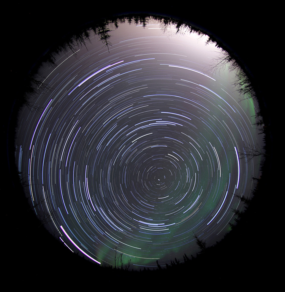 Star trails in the far northern sky appear as circular streaks