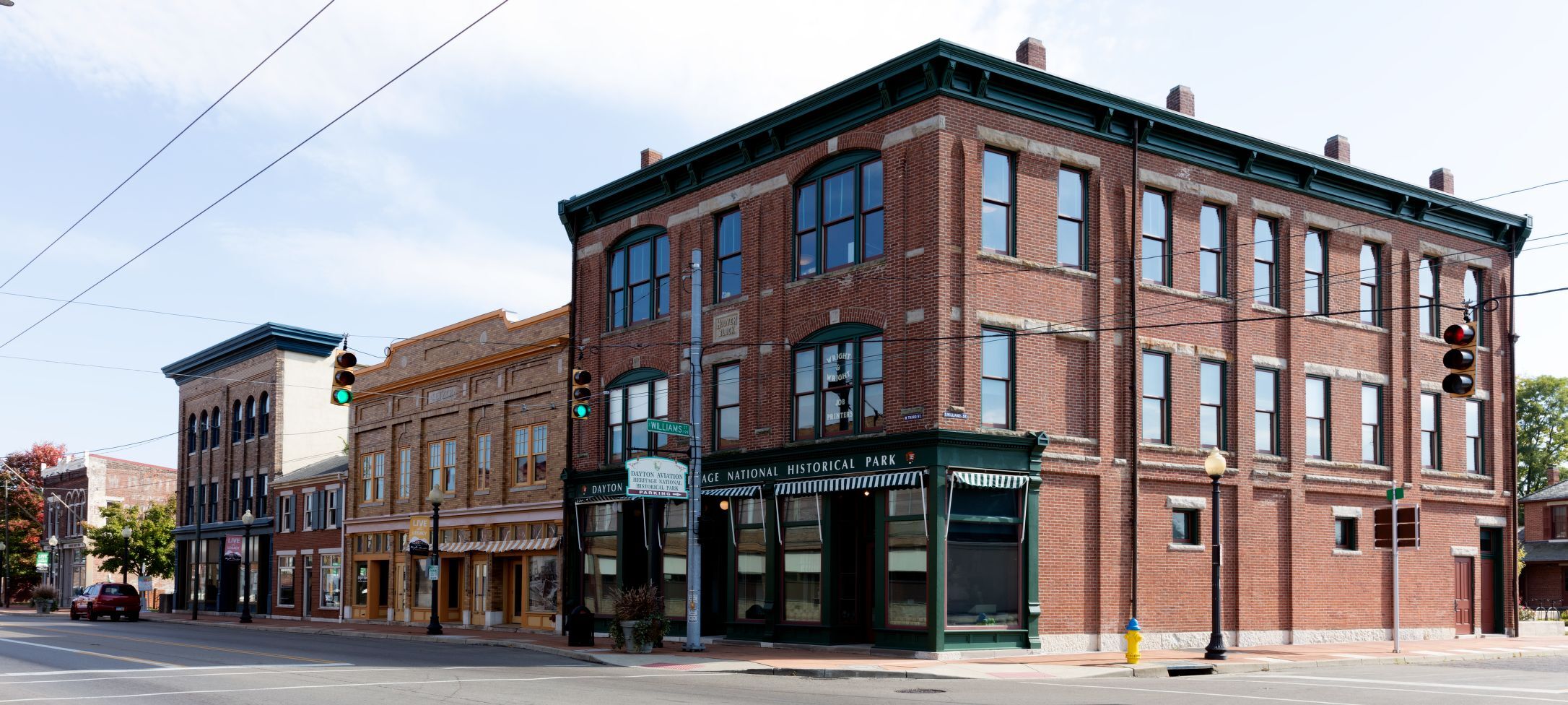 An intersection of West Third Street Historic District of Dayton, with 2 to 3 story brick structures lining a street
