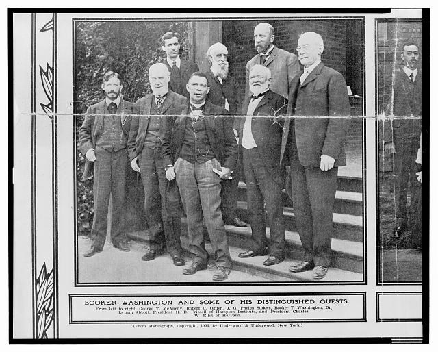 Booker T. Washington, standing center, with George T. McAneny, Robert C. Ogden, an unidentified man, George W. Eliot, J.G. Phelps Stokes, Dr. Lyman Abbott, and Hollis B. Frissell.
