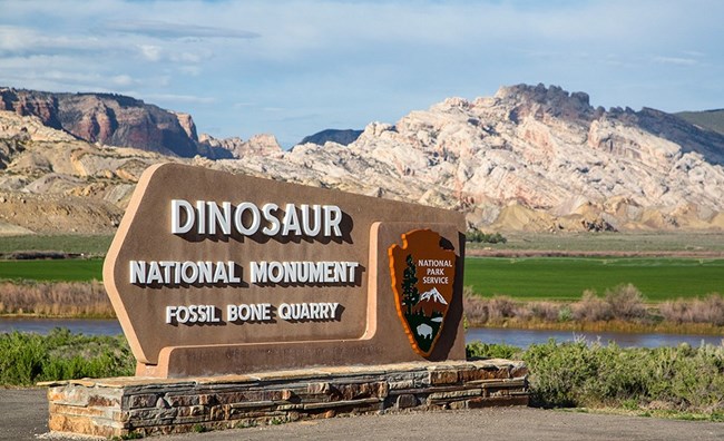 Photo of park entrance sign for Dinosaur National Monument