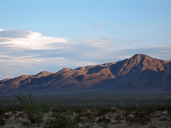 Photo of a desert basin with mountains in the distance