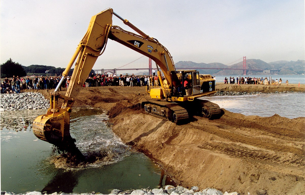 heavy equipment adding sand to the beach