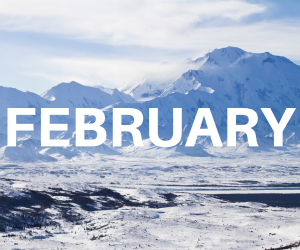word February over background of snow covered mountains