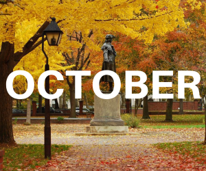 word October over background of fall foliage