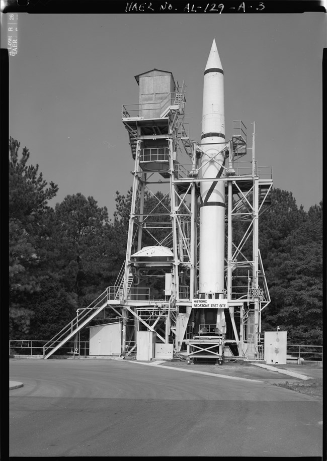Black & white photo of Redstone rocket on test stand