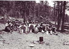 Civilian Conservation Corps (CCC) men taking a lunch break at Rocky Mountain National Park, c. 1930s. NPS Photo by George A. Grant.