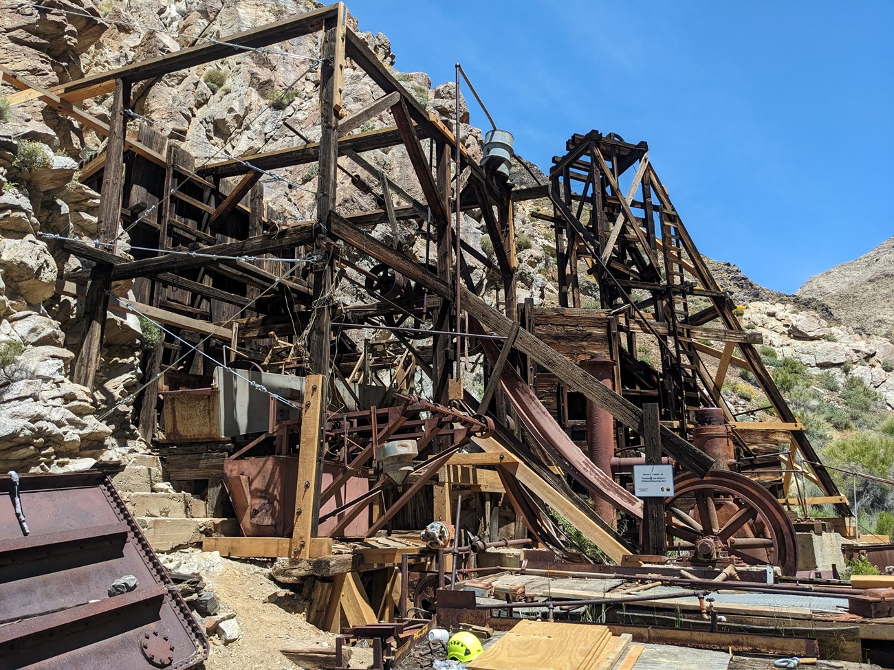 a wooden structure built into the side of a rocky hill