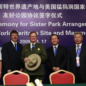 The Mammoth Cave National Park superintendent attends a formal dinner in China to sign a sister park arrangment document.