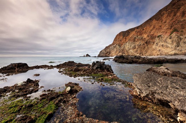 rocks emerging from intertidal zone at the edge of Anacapa Island