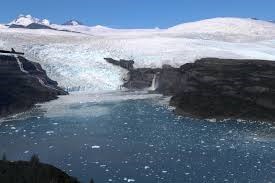 A tidewater glacier with small icebergs