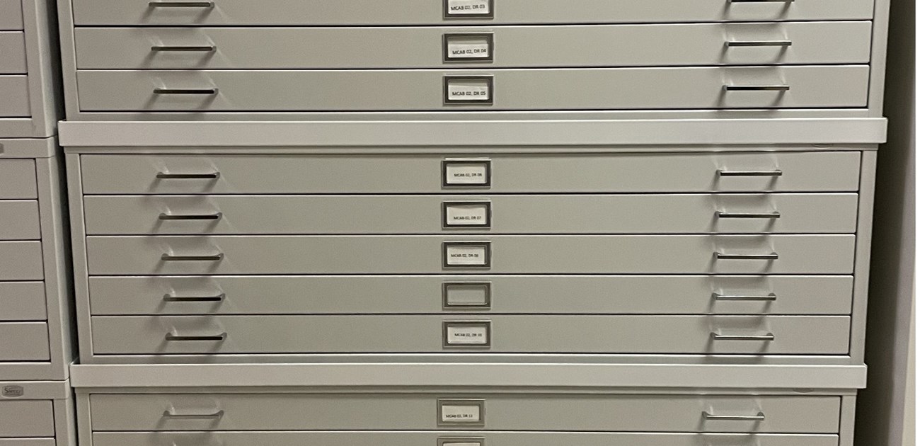 Close up of a flat file stack showing stacking rims between the units.