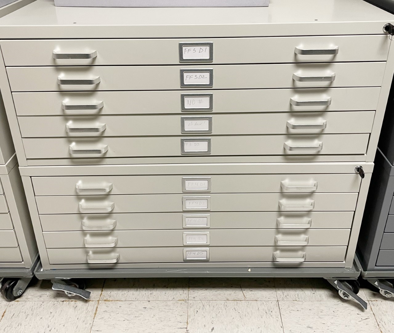 A stack of standard flat file units on a wheeled base.