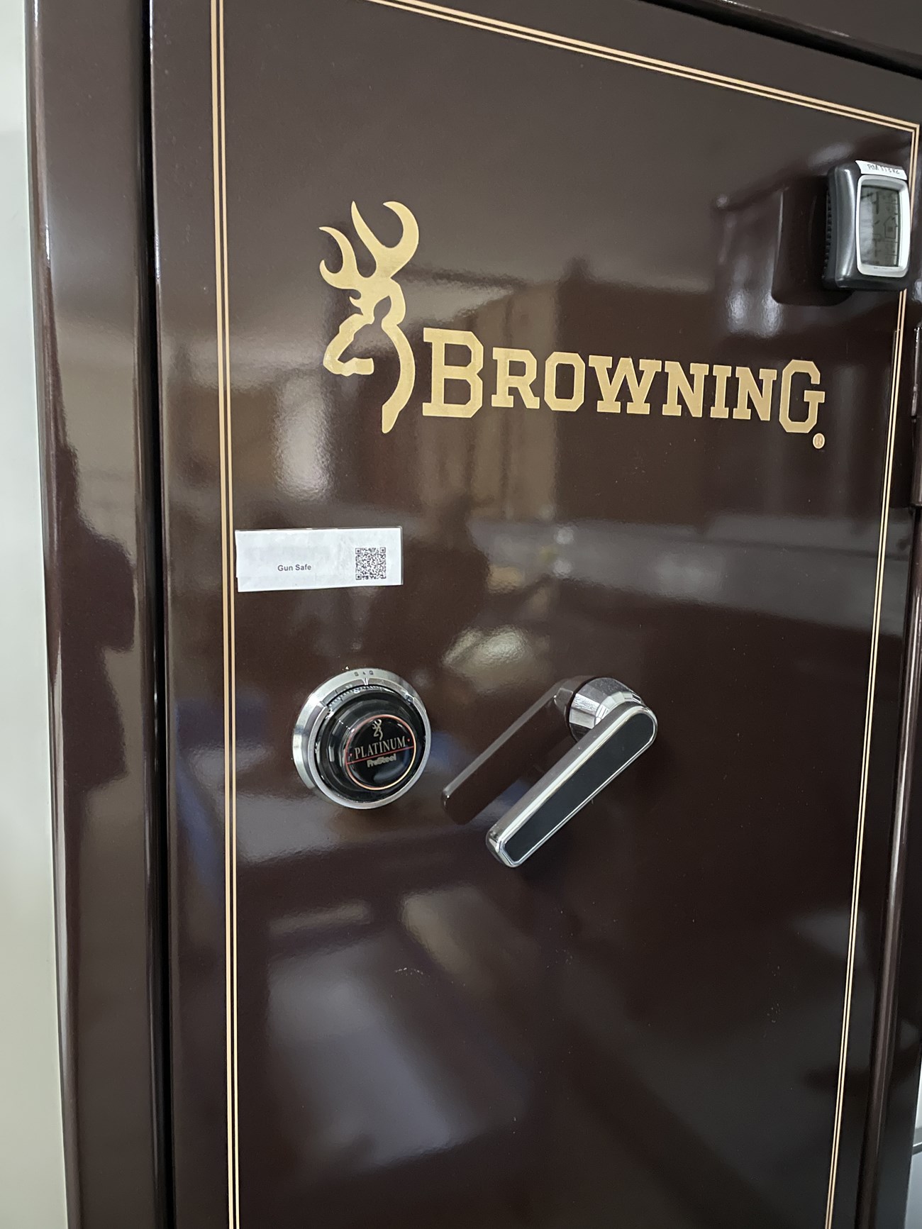 A closeup of the combination locking mechanism on a gun safe.