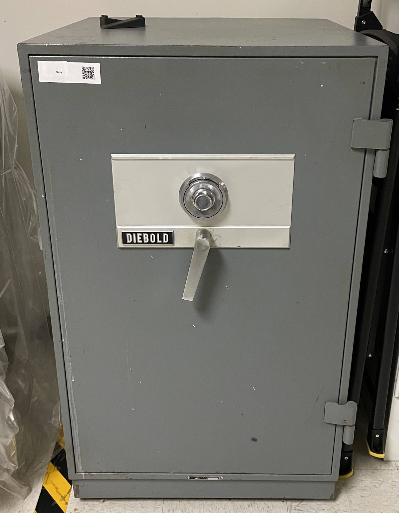 A gray safe to hold valuable collctions.