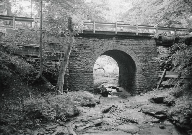 Stone arch culvert over creek
