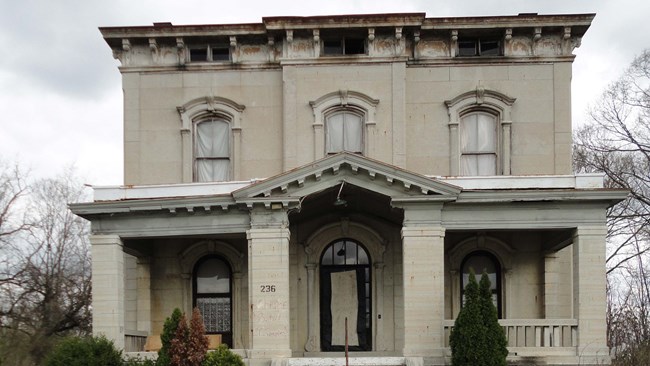 Three story residence built in Italianate tuscan Villa in Renaissance Revival architectural style.