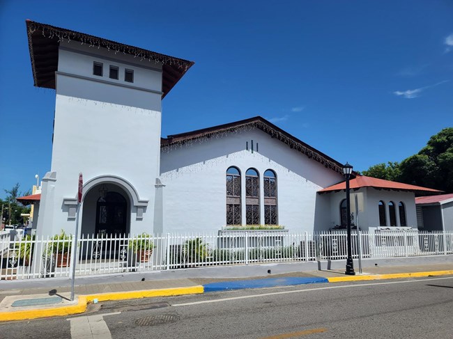 One story white church with bell tower