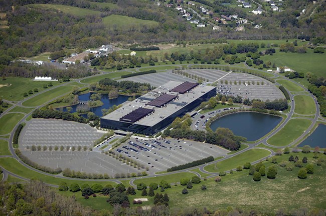 Image of building, roads, parking lots, lakes, and landscaping.