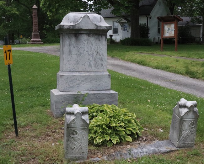 Image of white stone grave markers.