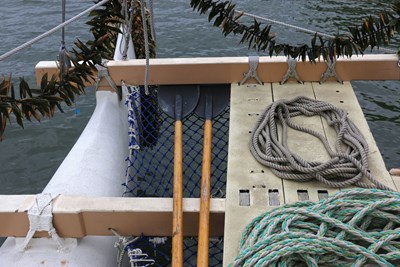 View of rope rigging, oars and the deck of a boat