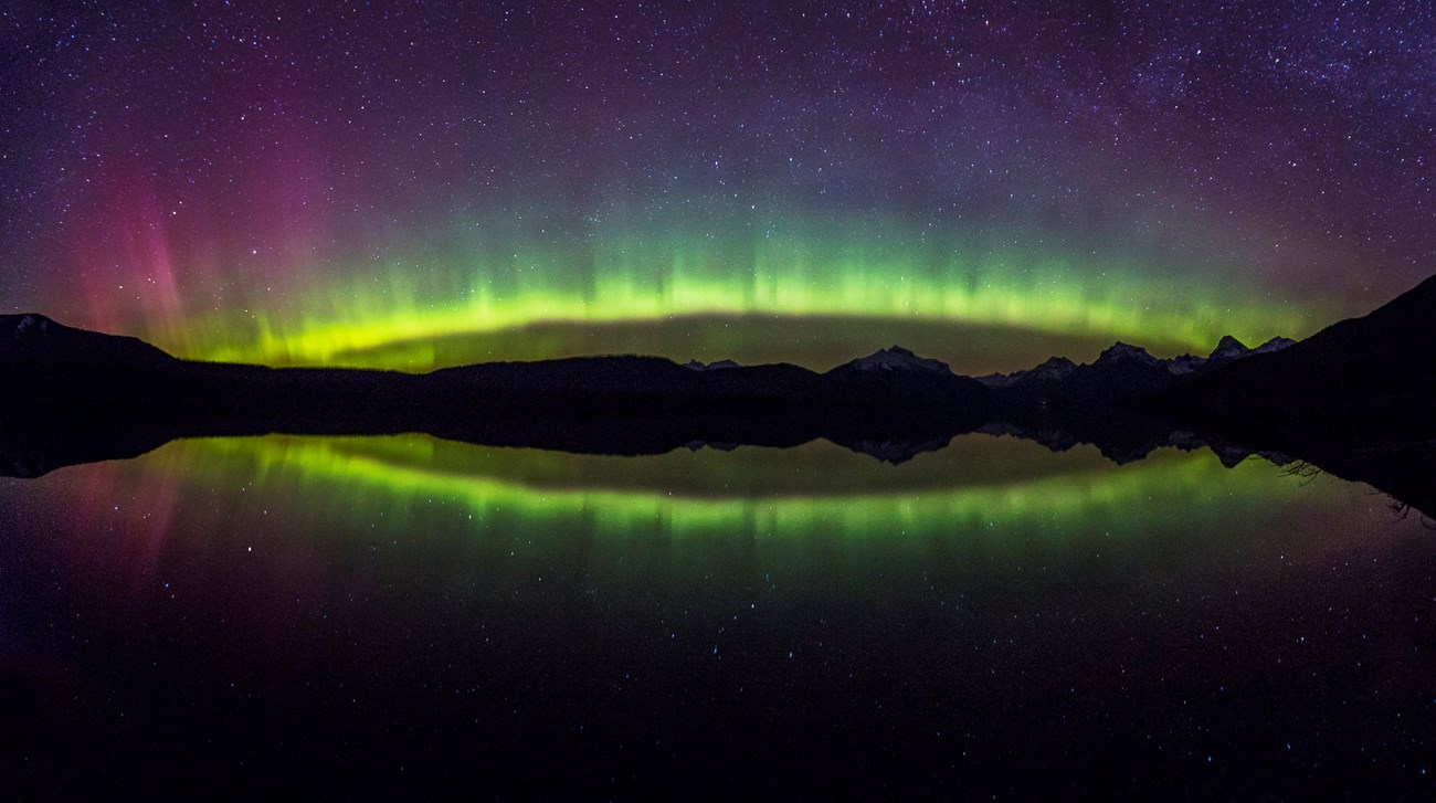 Aurora borealis arch over Lake McDonald, Glacier National Park