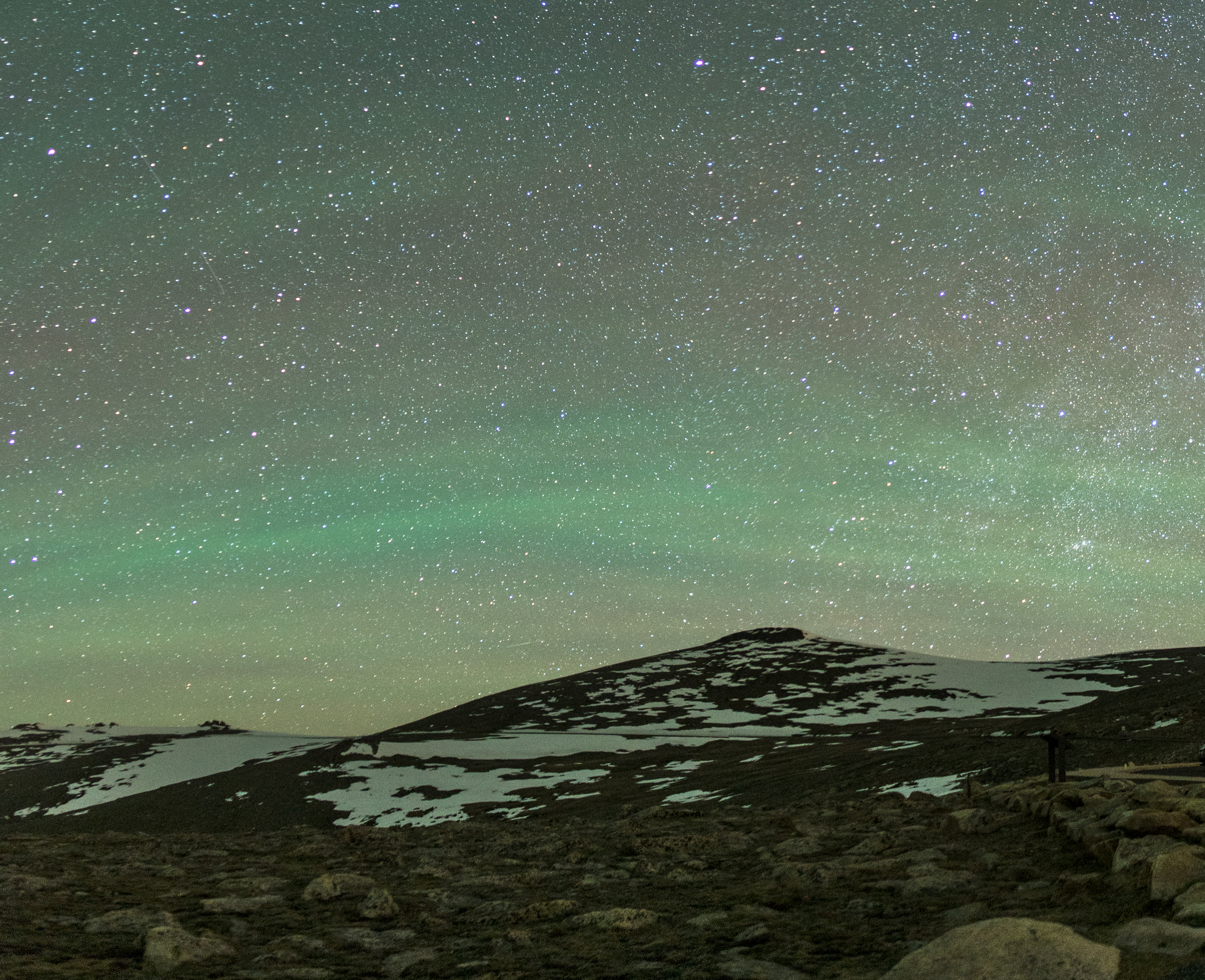 Airglow of greens and blues at night over Forest Canyon Overlook, Rocky Mountain National Park