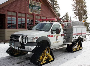 A fire engine in front of Old Faithful Snow Lodge in Yellowstone National Park.