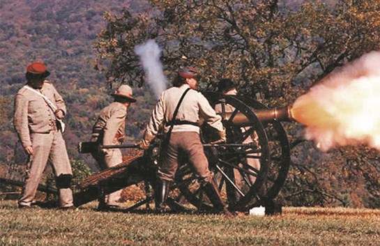 Costumed actors Actors as soldiers fire the cannon during a Civil War battle reenactment