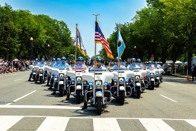 U.S. Park Police officers in a mortocycle formation on a parade route