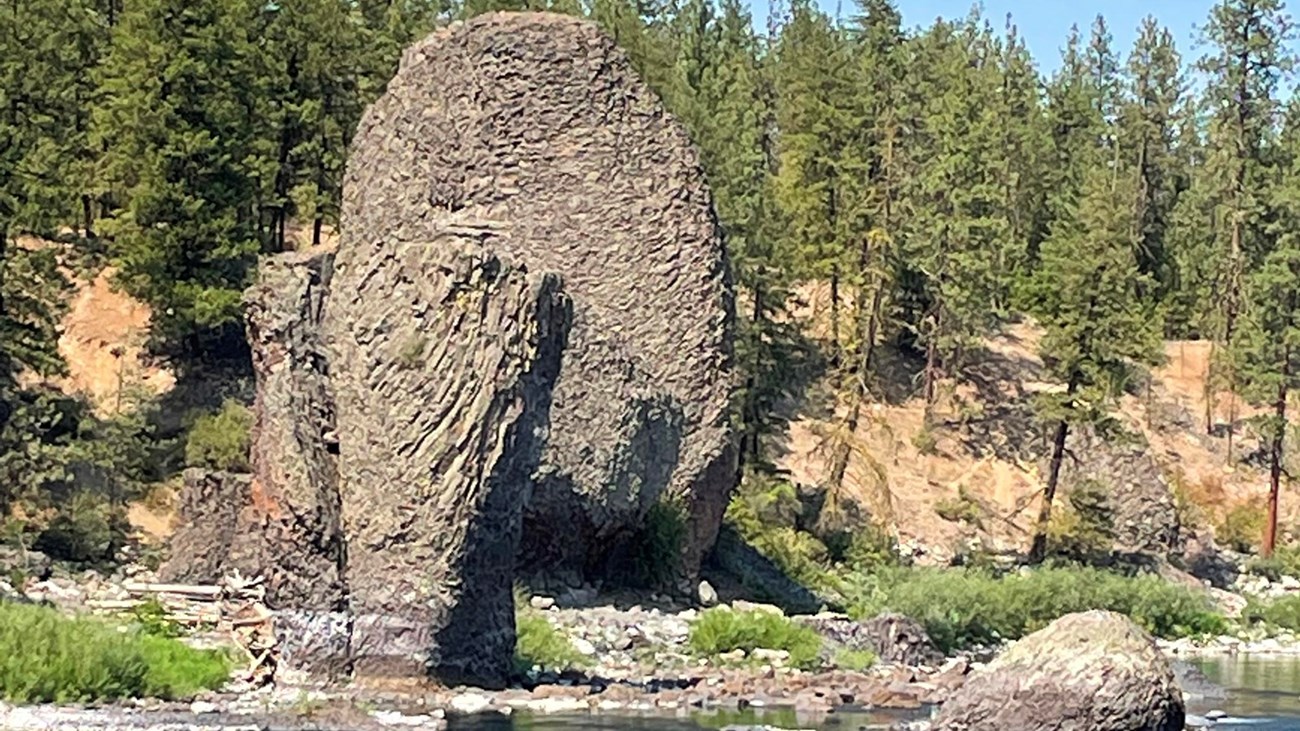 photo of unusual rock formations next to a river