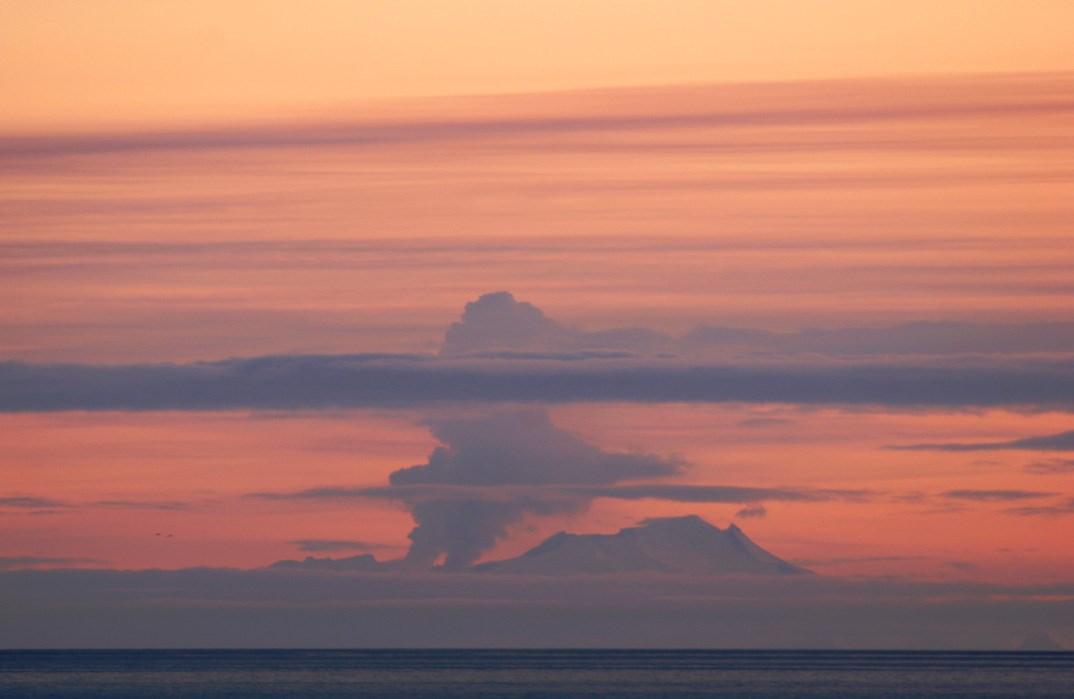 distant view of erupting volcano
