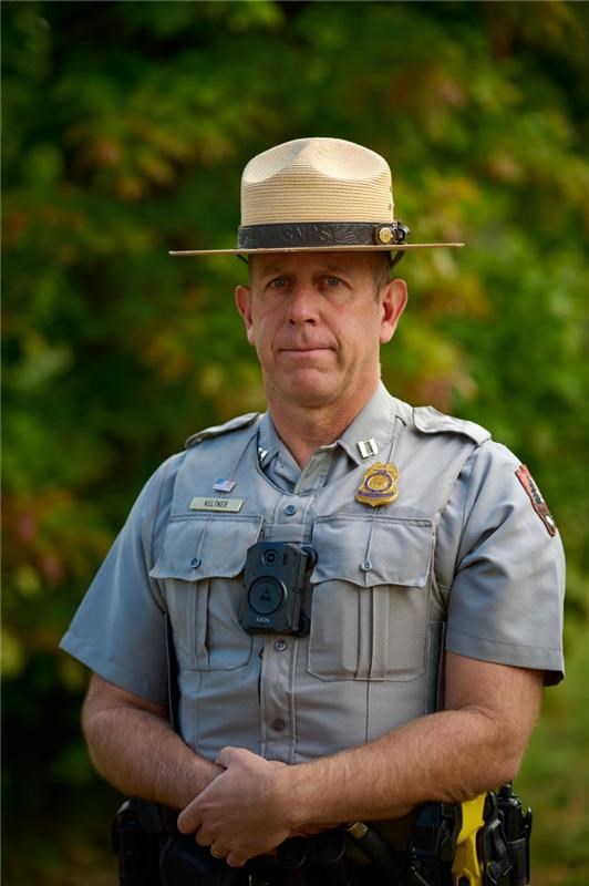 David Keltner stands outside in uniform.