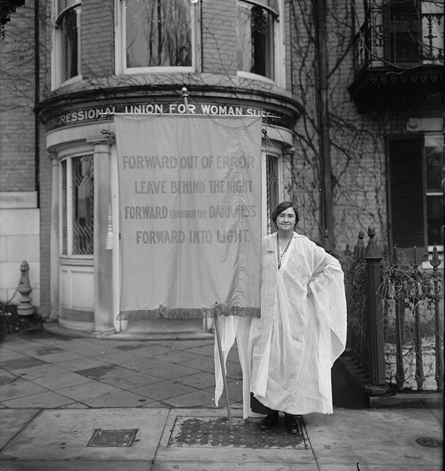 Woman holding sign in favor of Women’s Suffrage, circa 1910-1920. Courtesy Library of Congress.