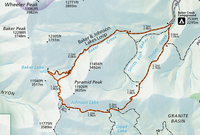 A color image of a selection of the official park map. A grey road emerges from the top and connects to an orange highlighted trail labeled "Baker & Johnson Lakes Loop."