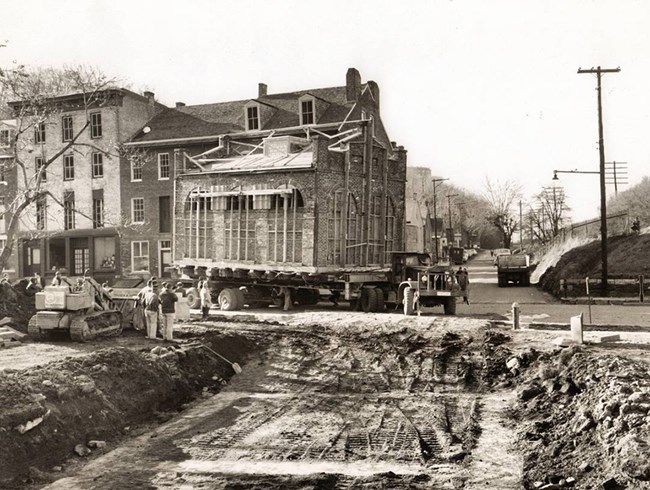 John Brown's Fort atop a truck, being transported to current location in Lower Town