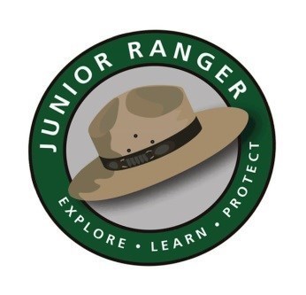 a ranger hat encircled by a green band with the text: Junior ranger explore learn protect.
