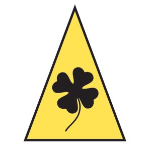 A yellow triangle with a black four leaf clover inside of it.