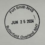 A circular ink stamp with the text, "Fort Smith NHS, JUN 25 2024, Butterfield Overland NHT."