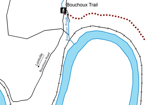 map of bouchoux trailhead and path. trailhead is on bouchouxville road where it intersects with bouchoux brook. The trail goes east, following the bend of a larger river. Driving away from the trailhead on bouchoux road goes to lordville.