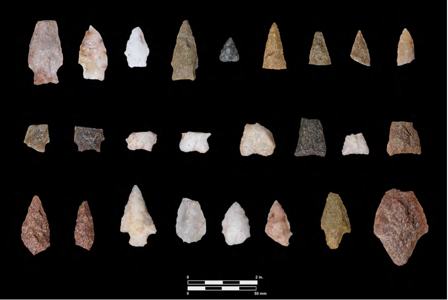 Stone tools on a black background.