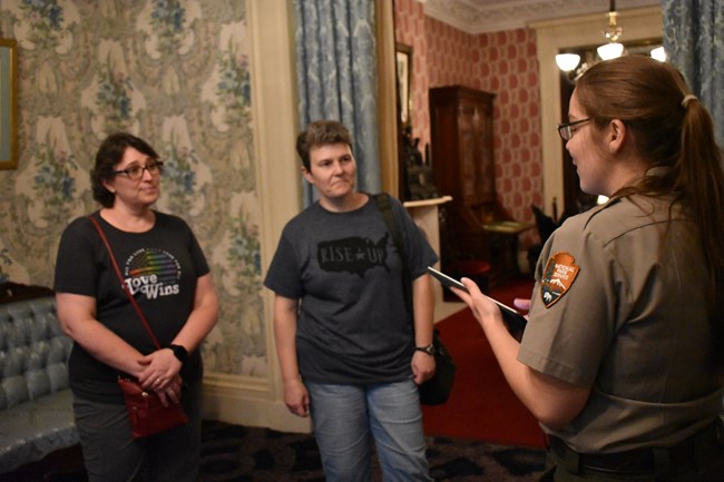 Ranger guides visitors in residence